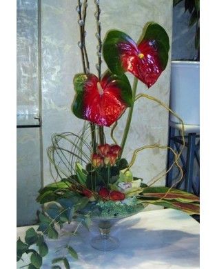 Arrangement with flowers on a fruit bowl
