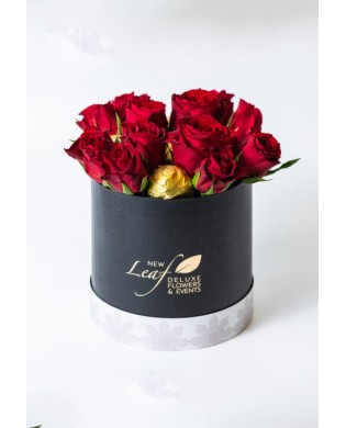 Roses and chocolates in a box