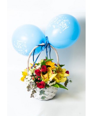 Basket with colorful flowers and balloons